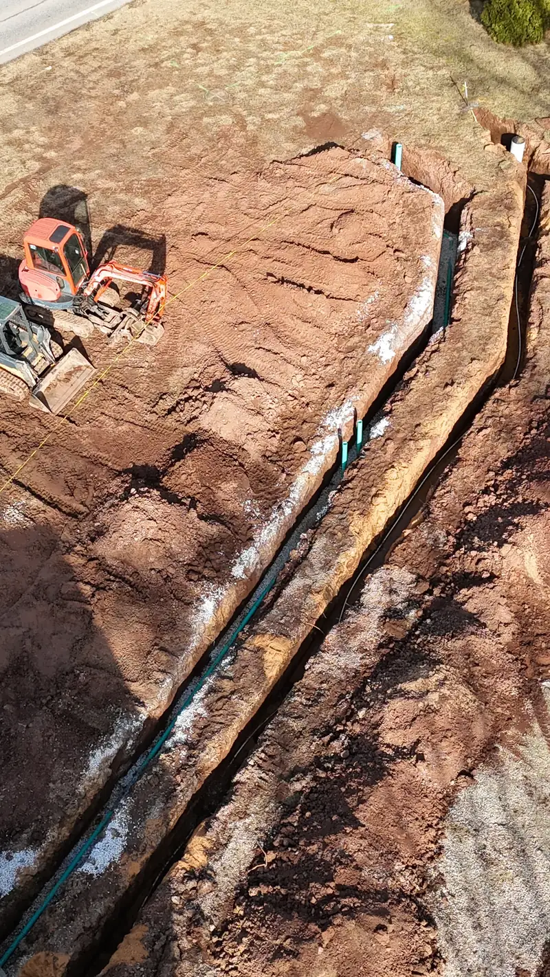 Drone view of a graded residential lot with a cleared tree line, prepared by Crone's Excavation in York County, PA