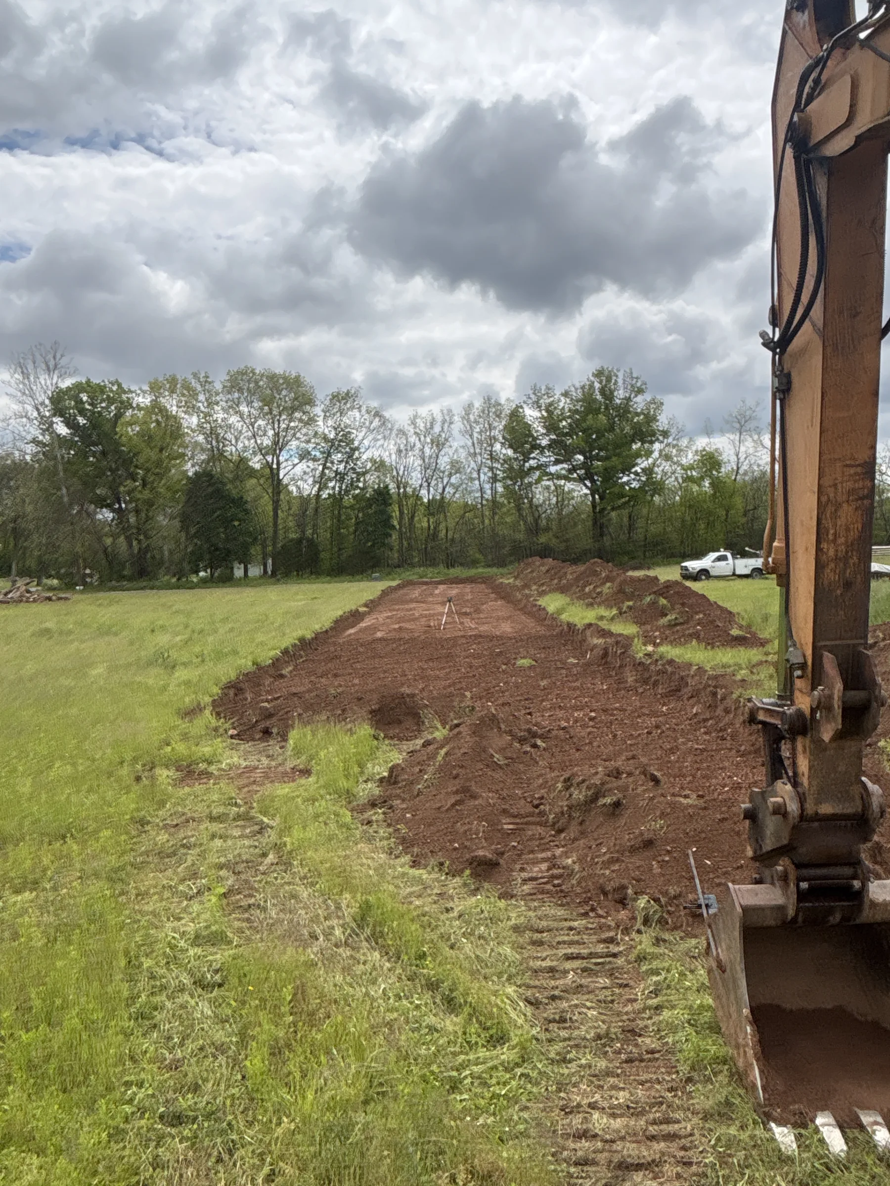 Crone's Excavation crew running an excavator and skid steer on a Dover, PA project