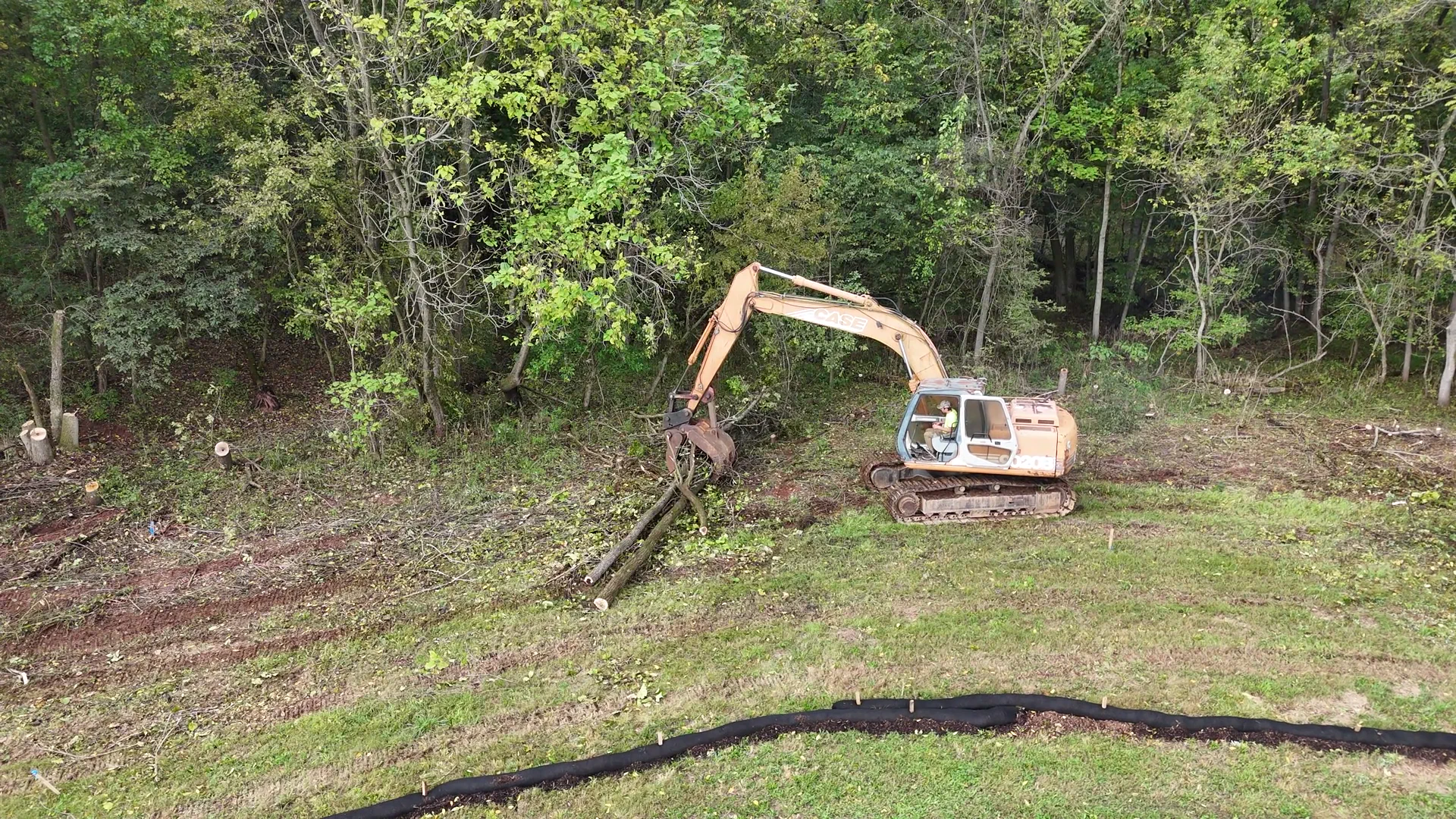 Land clearing in progress, wooded lot