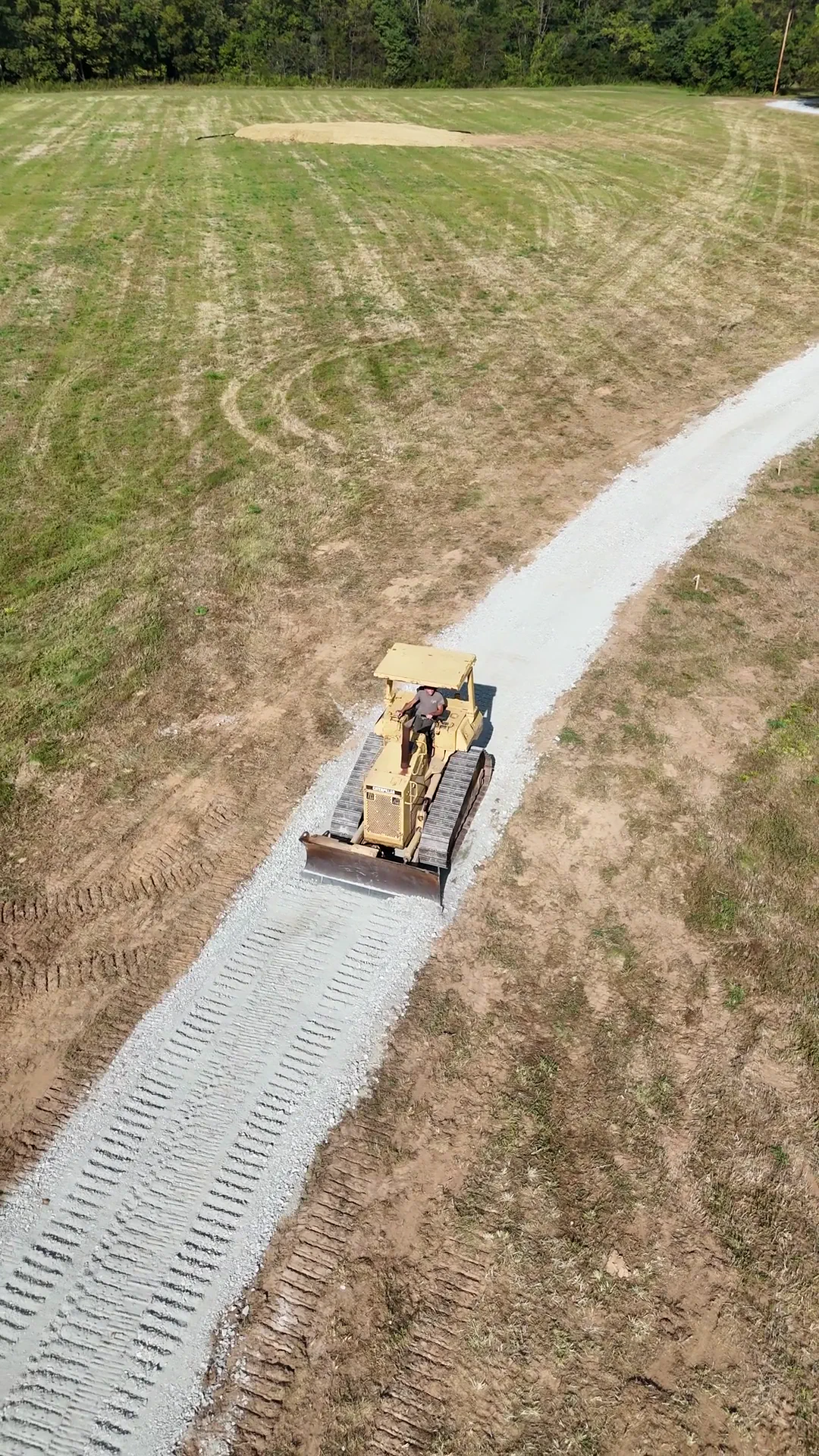 Skid steer on prepared geotextile, York County